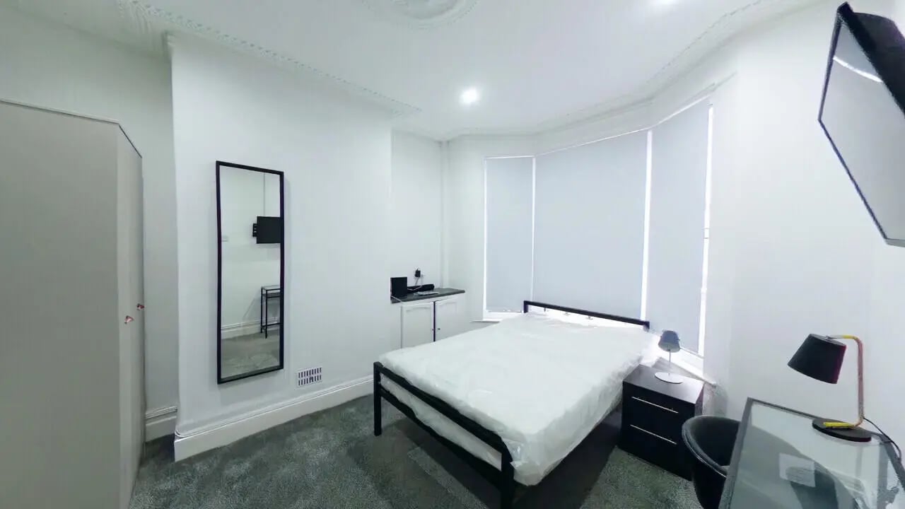 Bed wardrobe mirror desk with laptop bedroom at 4 Bedroom House at 120, Adelaide Road in Liverpool Student Accommodation