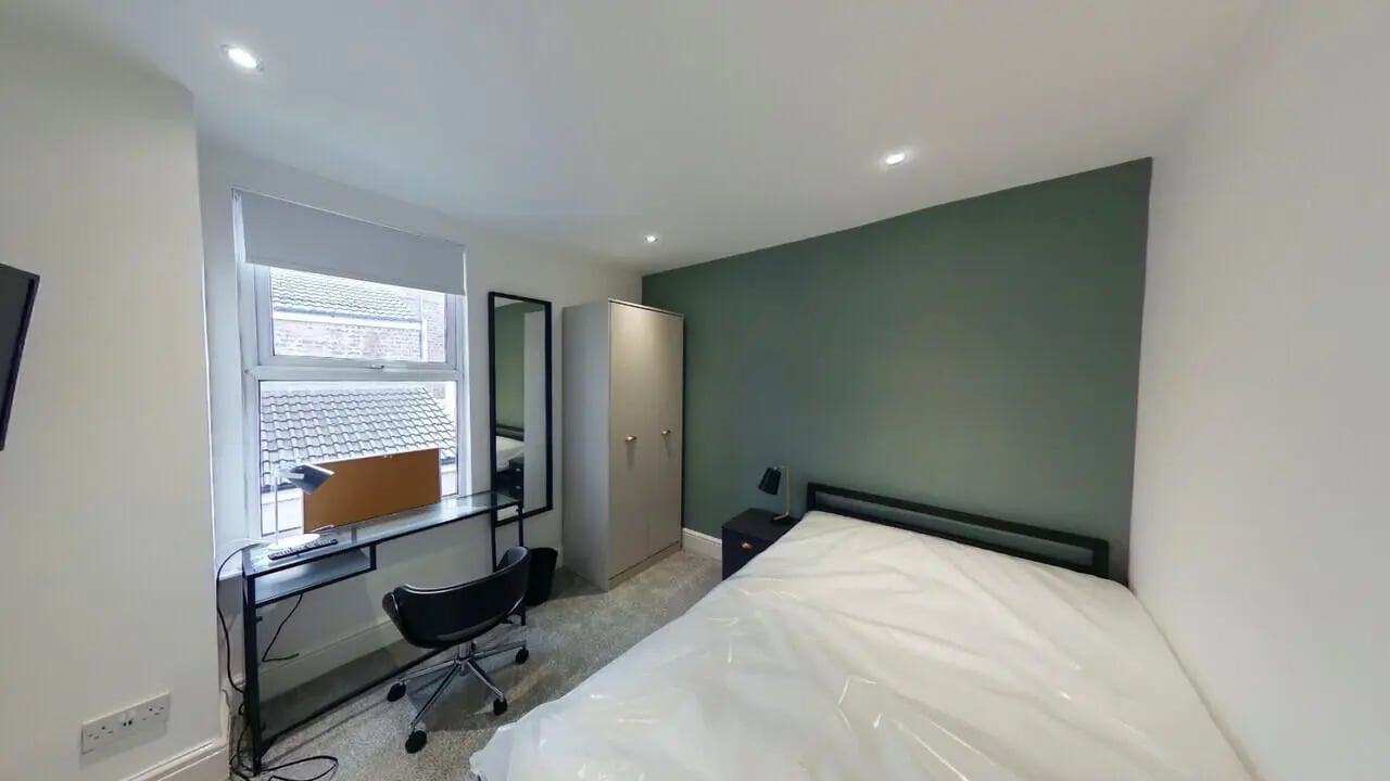 Bed wardrobe desk chair mirrored bedroom at 4 Bedroom House at 120, Adelaide Road in Liverpool Student Accommodation