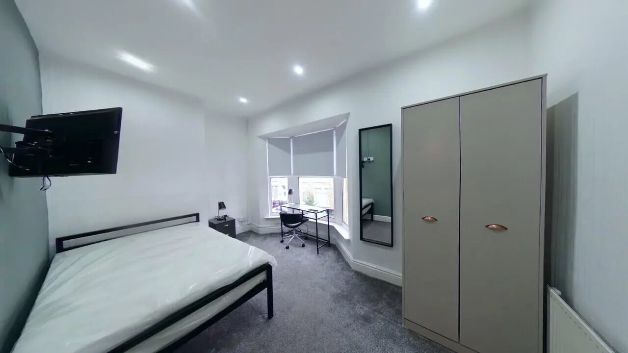 Bed desk television wardrobe bedroom at 4 Bedroom House at 120, Adelaide Road in Liverpool Student Accommodation