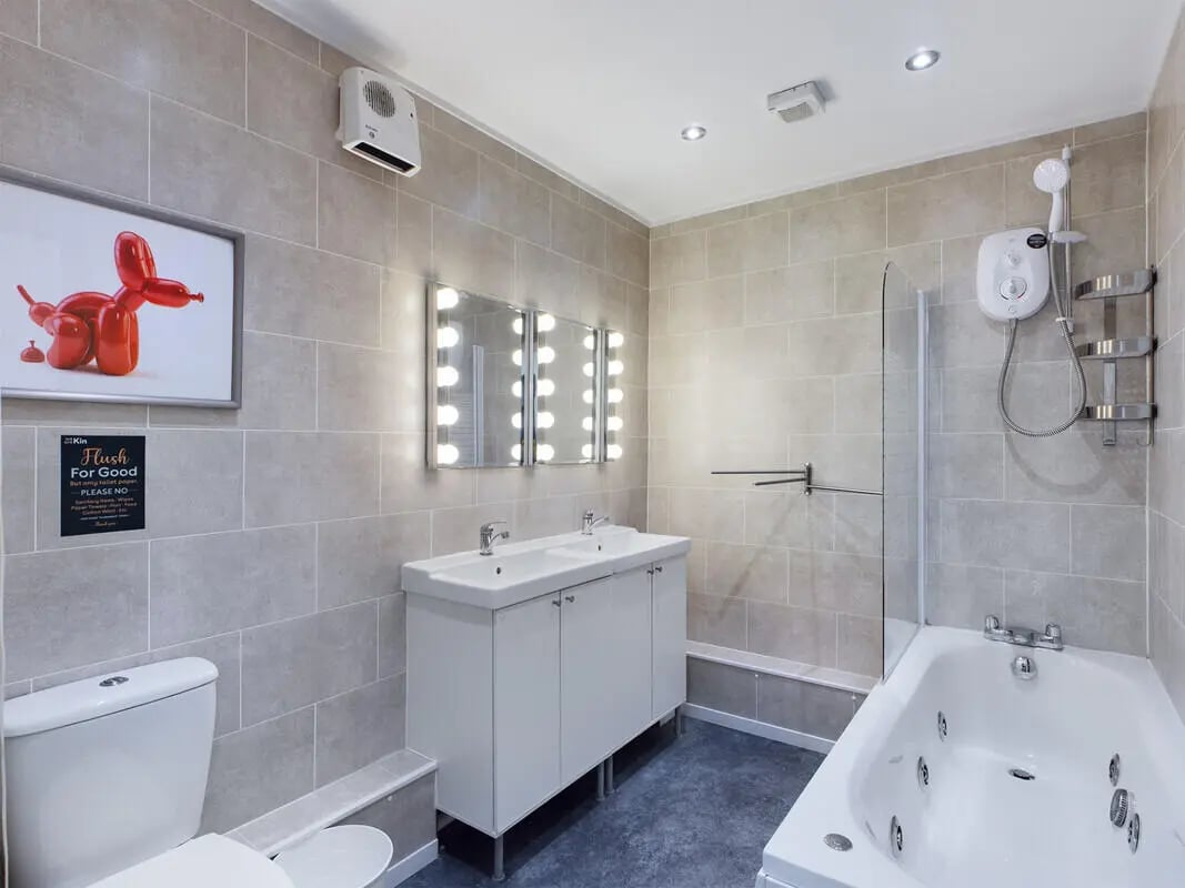 Toilet sinks bathtub shower and art bathroom at 6 Bedroom House at 328, Upper Parliament Street in Liverpool Student Accommodation