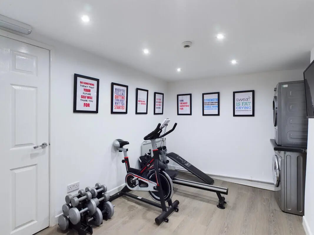 Spin bike weights bench and laundry area at 6 Bedroom House at 328, Upper Parliament Street in Liverpool Student Accommodation