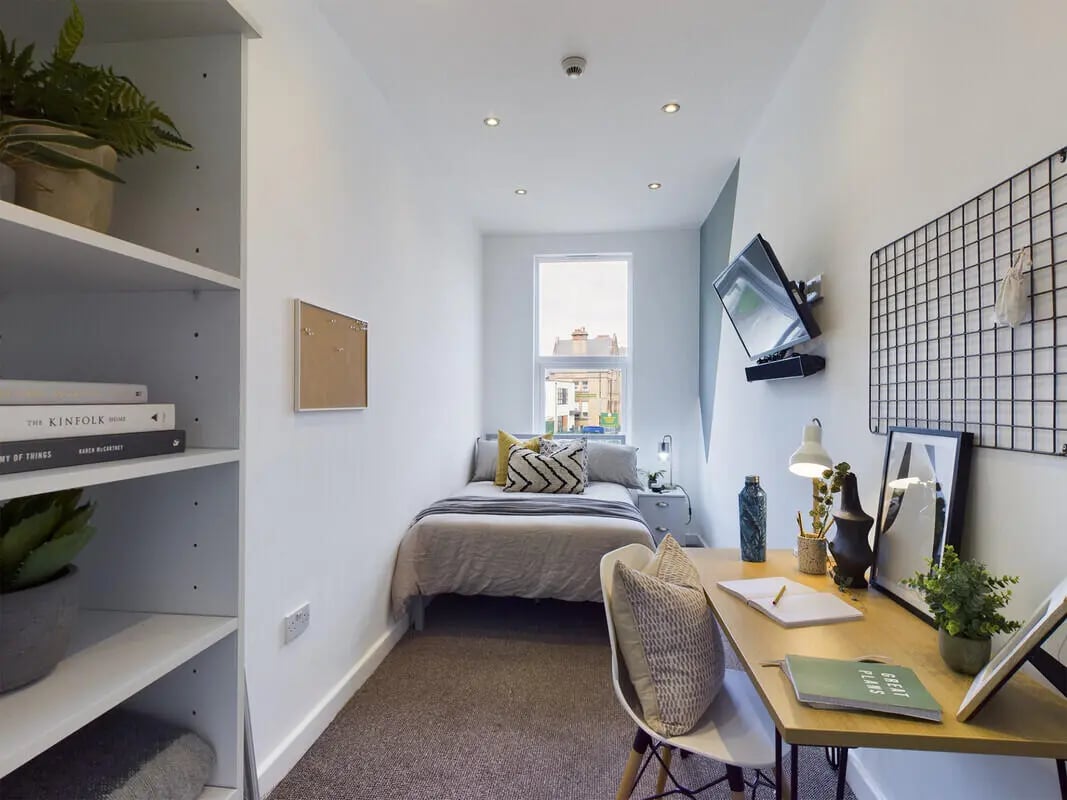 Bed desk plant and shelves bedroom study area at 6 Bedroom House at 328, Upper Parliament Street in Liverpool Student Accommodation