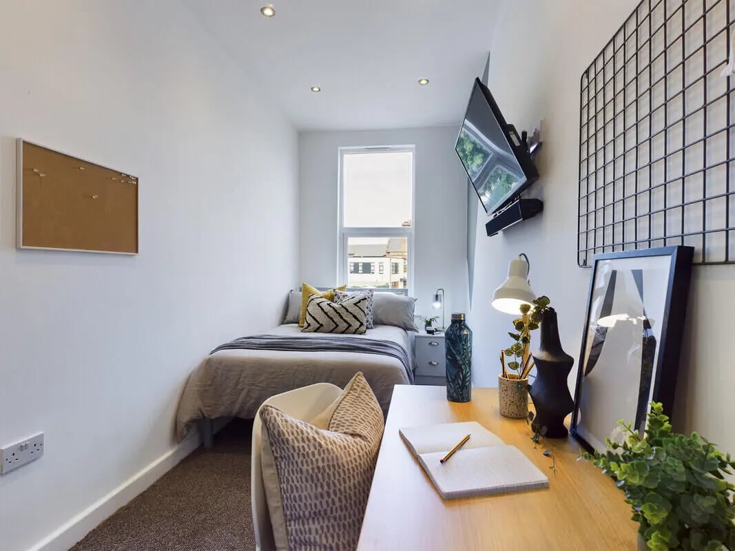 Bed desk TV and corkboard bedroom at 6 Bedroom House at 328, Upper Parliament Street in Liverpool Student Accommodation