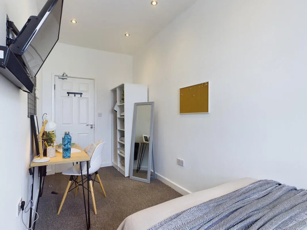 Desk chair, wardrobe, mirror, and bed Bedroom at 6 Bedroom House at 328, Upper Parliament Street in Liverpool Student Accommodation
