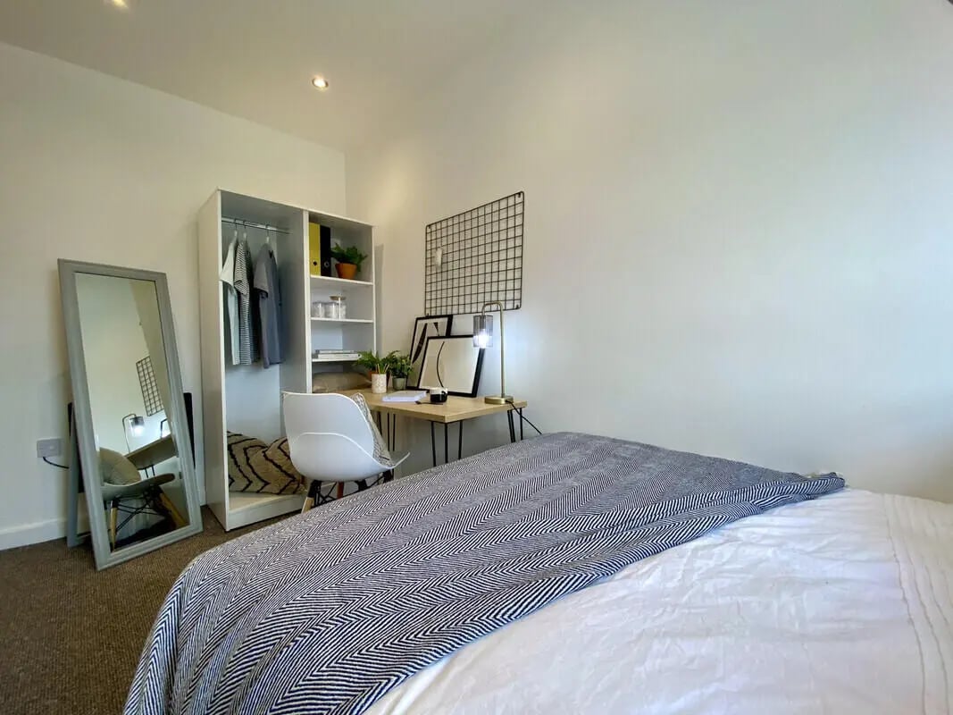 Bed wardrobe desk mirror chair bedroom at 2 Bedroom House at Flat 2, 36, CARLTON AVENUE in Manchester Student Accommodation