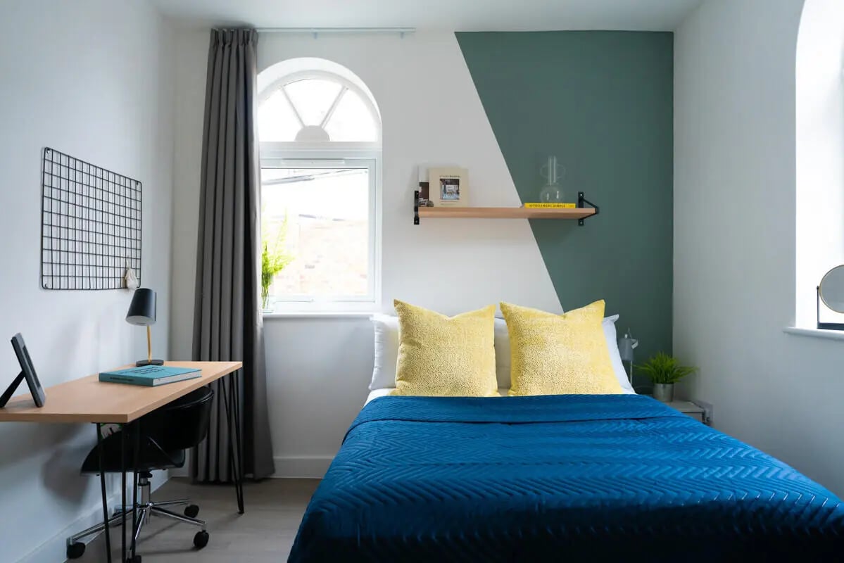 Desk bed pillows shelf window study bedroom at 5 Bedroom House at 6, Maine Road in Manchester Student Accommodation