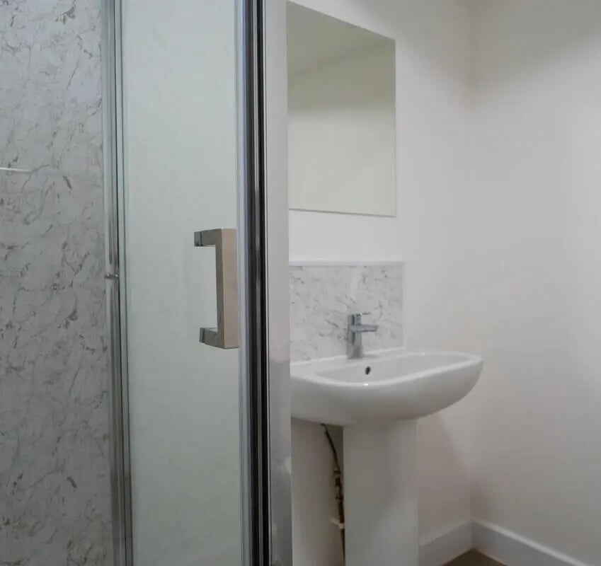 Marble shower sink and mirror bathroom at 5 Bedroom House at 6, Maine Road in Manchester Student Accommodation