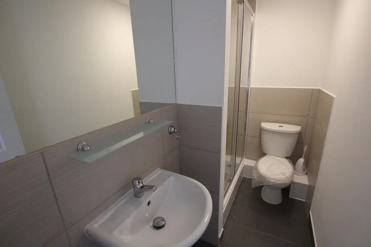 Sink toilet and shower stall bathroom at 6 Bedroom House at 49, Ruskin Avenue in Manchester Student Accommodation