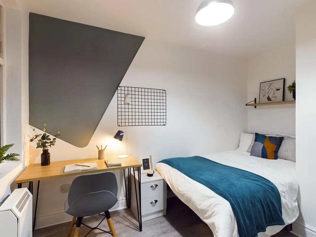 Desk chair bed pillows abstract art Bedroom at 6 Bedroom House at 10, Richmond Road in Lincoln Student Accommodation