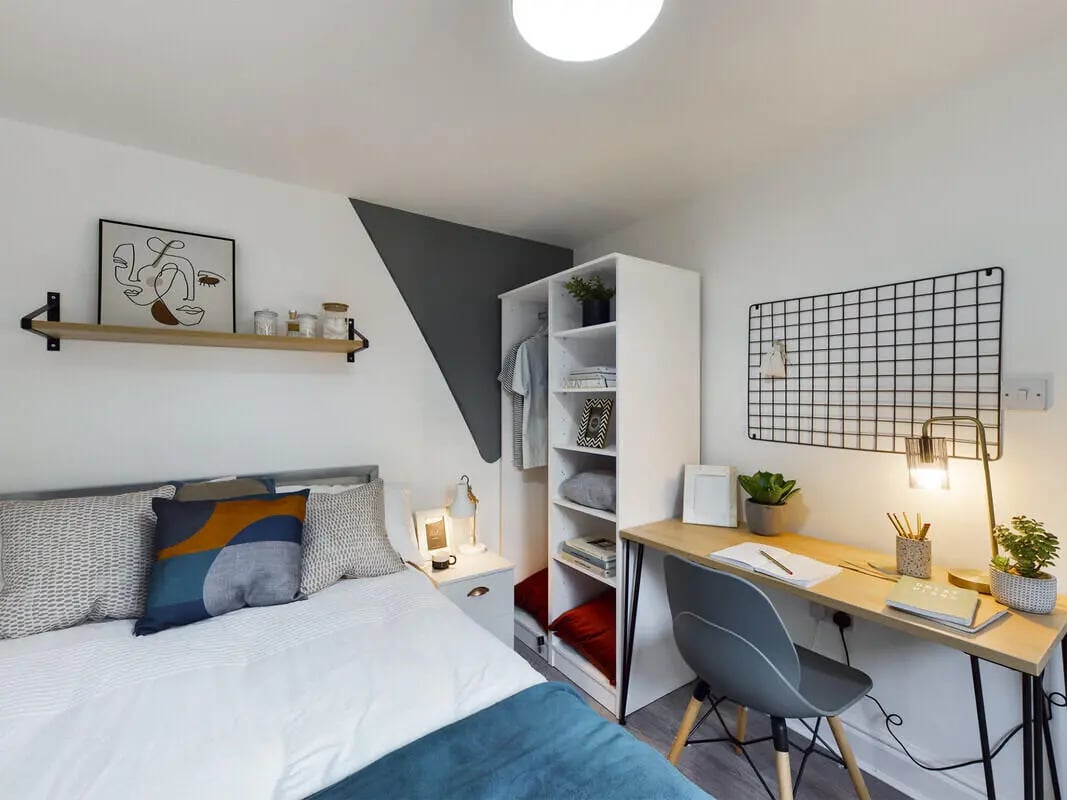 Bed desk shelving artwork and chair bedroom at 6 Bedroom House at 10, Richmond Road in Lincoln Student Accommodation