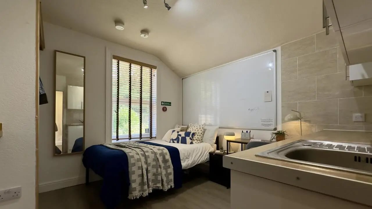 Bed whiteboard mirror sink kitchen studio at 6 Bedroom House at 12, Studios at, Richmond Road in Lincoln Student Accommodation