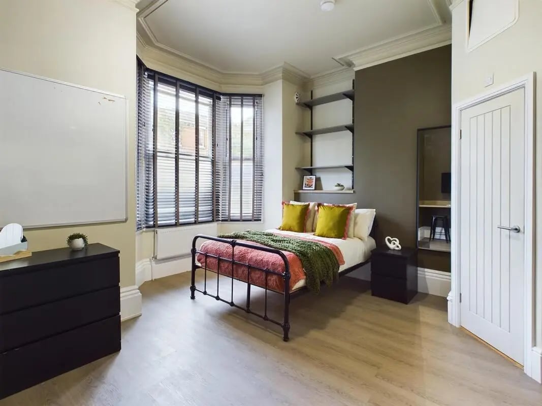 Bed dresser whiteboard and shelves Bedroom at 7 Bedroom House at 19, Studios at, The Avenue in Lincoln Student Accommodation