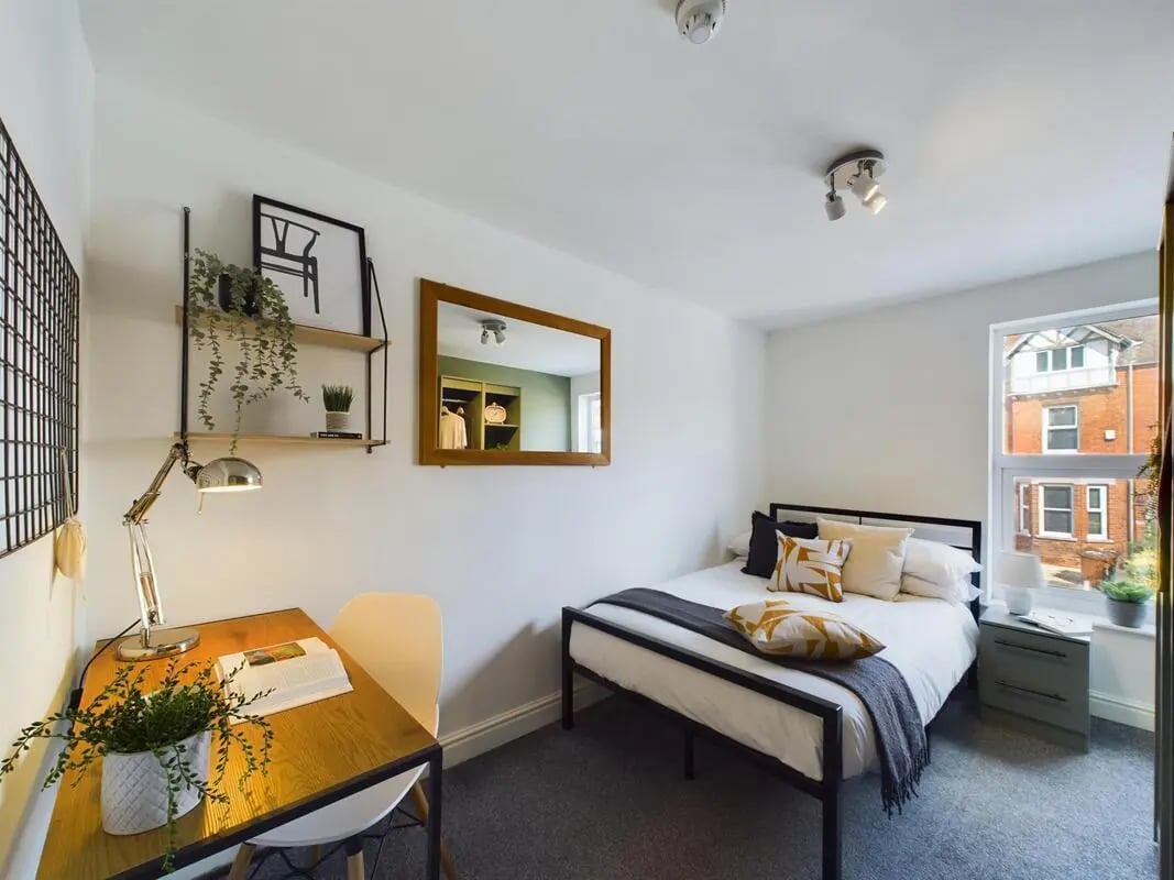 Bed desk mirror and plants bedroom at 6 Bedroom House at 73, West Parade in Lincoln Student Accommodation