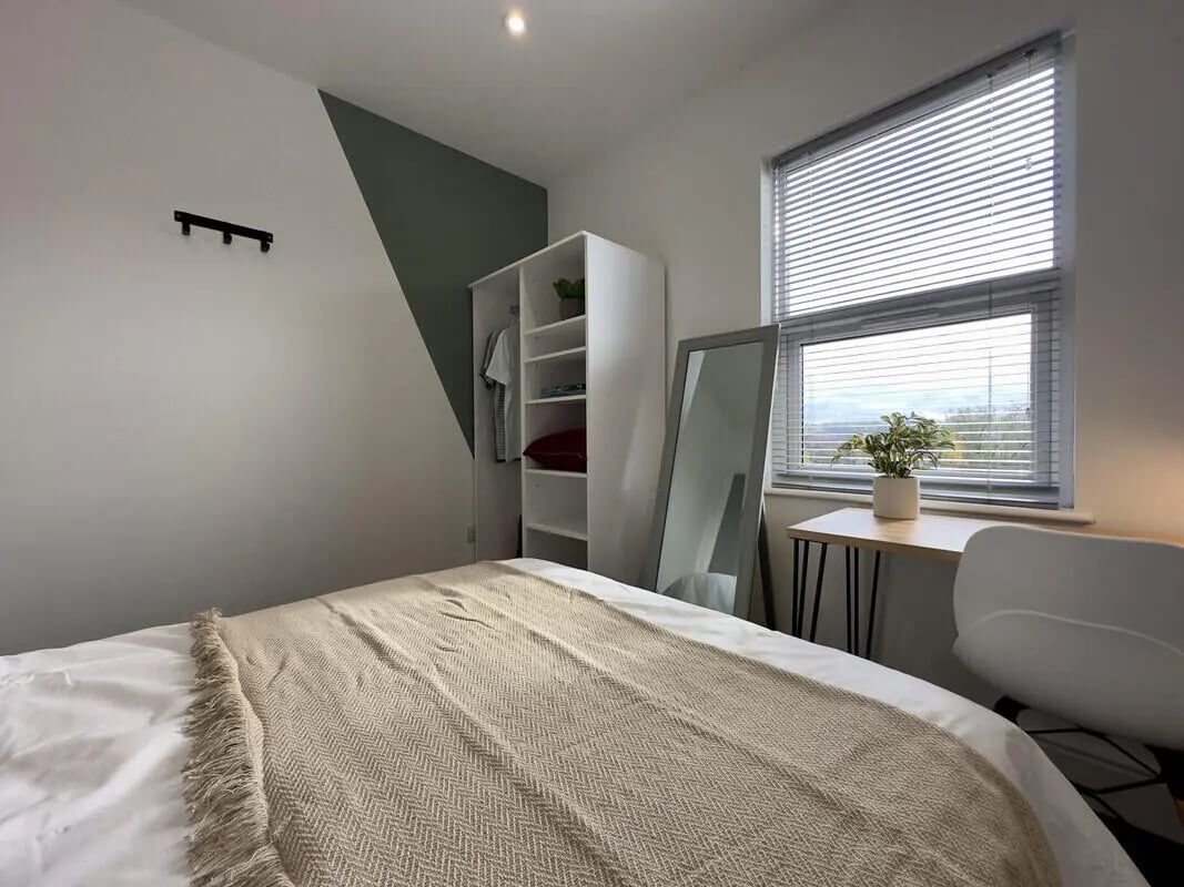 Bed wardrobe mirror desk and chair bedroom at 6 Bedroom House at 43, Monks Road in Lincoln Student Accommodation