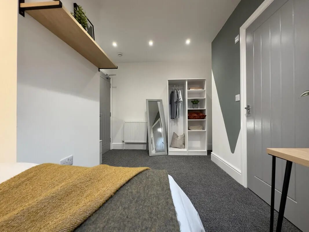 Wardrobe mirror shelves and bed bedroom at 6 Bedroom House at 43, Monks Road in Lincoln Student Accommodation