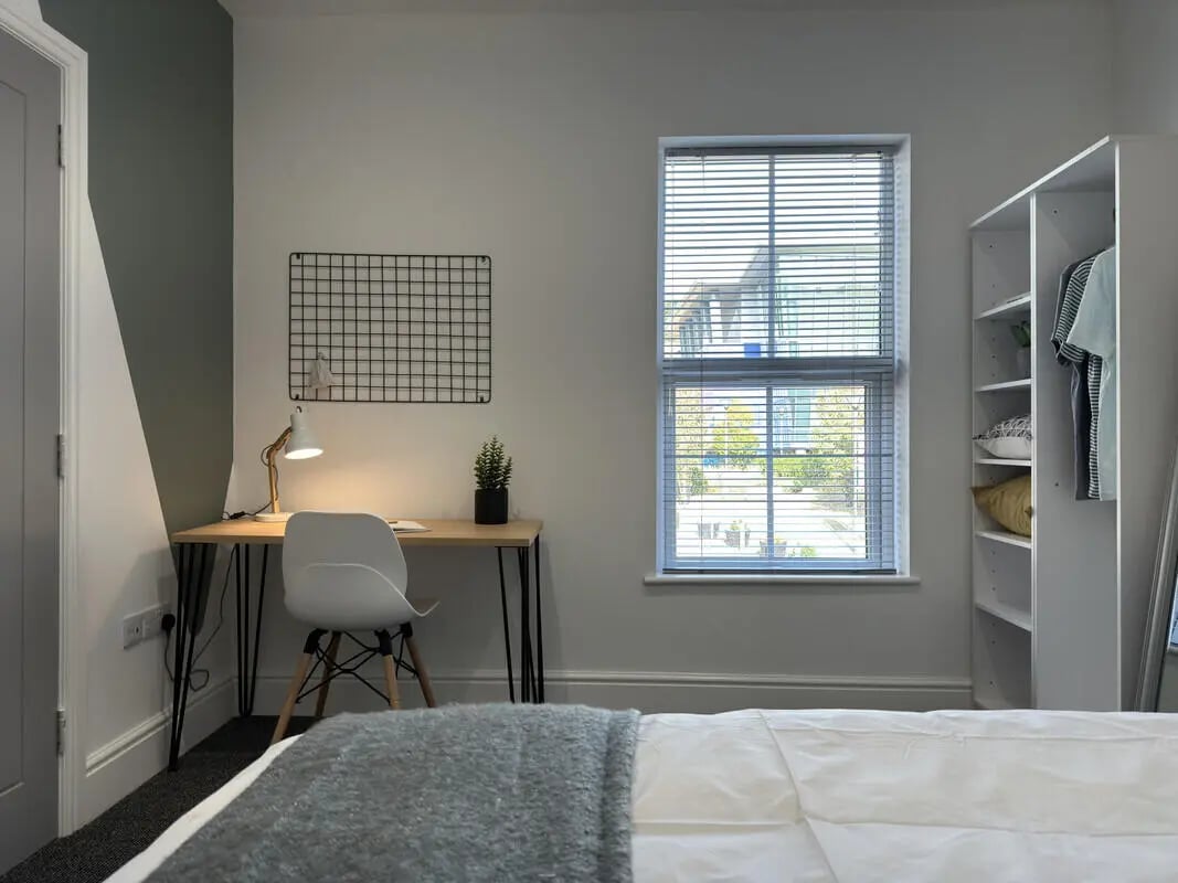 Desk chair grid lamp plant shelves bedroom at 6 Bedroom House at 43, Monks Road in Lincoln Student Accommodation