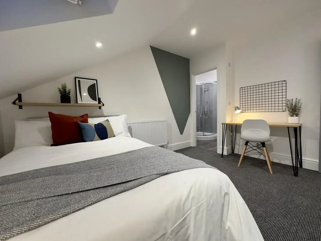 Bed desk shower room and radiator bedroom at 6 Bedroom House at 45, Monks Road in Lincoln Student Accommodation