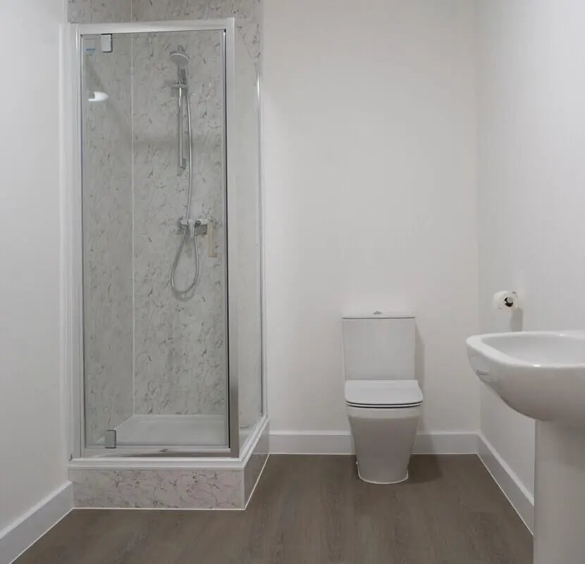 Shower toilet sink white bathroom at 8 Bedroom House at 71, Monks Road in Lincoln Student Accommodation