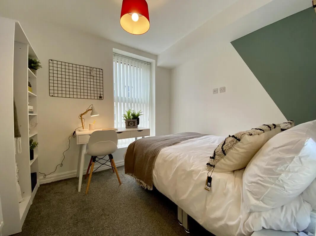 Bed desk chair shelf plant bedding bedroom at 1 Bedroom House at Flat 3, 261, Edge Lane in Liverpool Student Accommodation