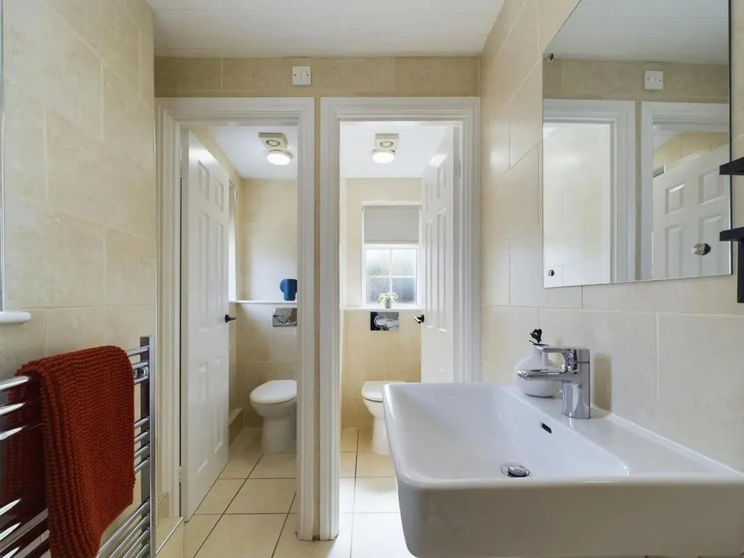 Sink towel rack two toilets bathroom at 9 Bedroom House at 19A, Bower Road in Sheffield Student Accommodation