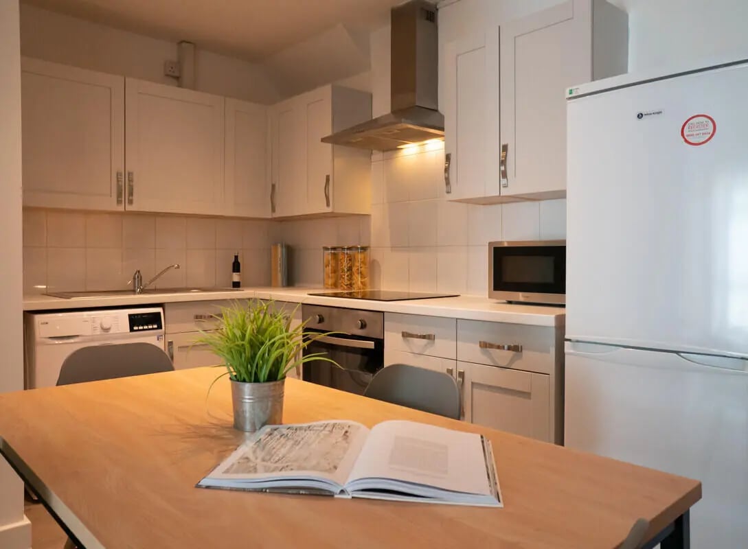 Kitchen with dining table open book and plant kitchen at 4 Bedroom House at 19B, Bower Road in Sheffield Student Accommodation