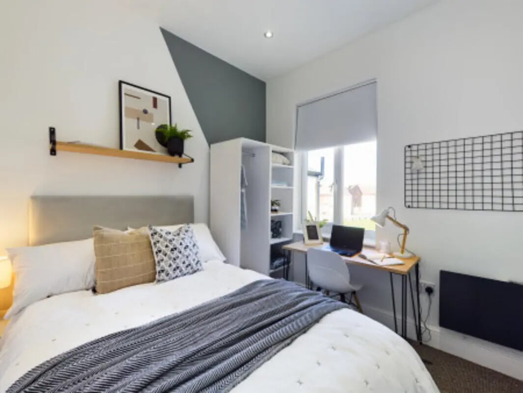 Bed with desk and shelves bedroom at 9 Bedroom House at 128, Uttoxeter New Road in Derby Student Accommodation