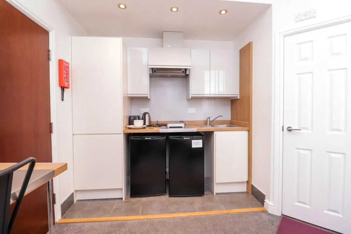 Kitchenette with mini fridges and cabinets kitchen area at 7 Bedroom House at 106, Yarborough Road in Lincoln Student Accommodation