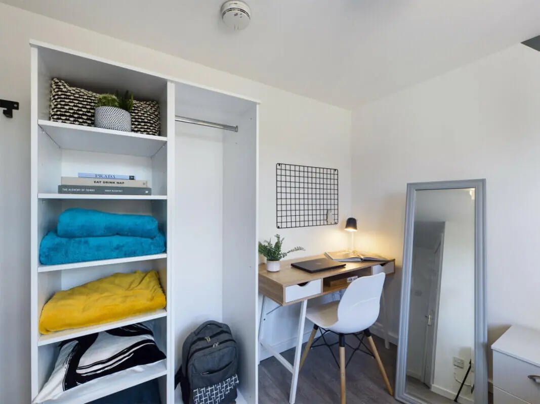Shelves desk chair and mirror bedroom at 4 Bedroom House at 75, Saxony Road in Liverpool Student Accommodation