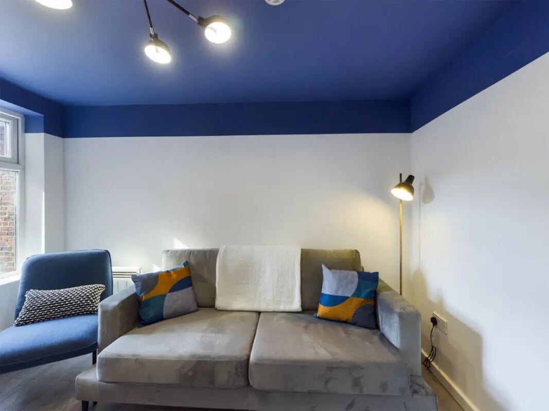 Sofa chair lamp with blue ceiling Living Room at 4 Bedroom House at 75, Saxony Road in Liverpool Student Accommodation