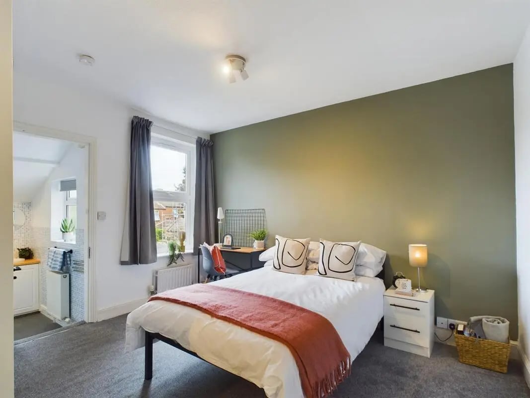 Bed desk pillows and blanket bedroom at 4 Bedroom House at 11, Charles Street West in Lincoln Student Accommodation