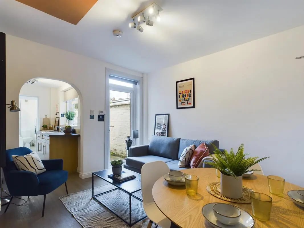 Sofa coffee table and dining set living room at 4 Bedroom House at 11, Charles Street West in Lincoln Student Accommodation