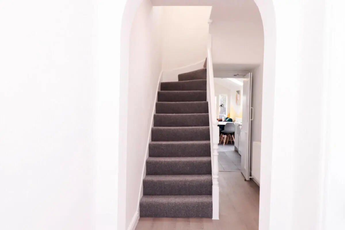 Carpeted stairs opening to kitchen area interior at 5 Bedroom House at 99, Monks Road in Lincoln Student Accommodation