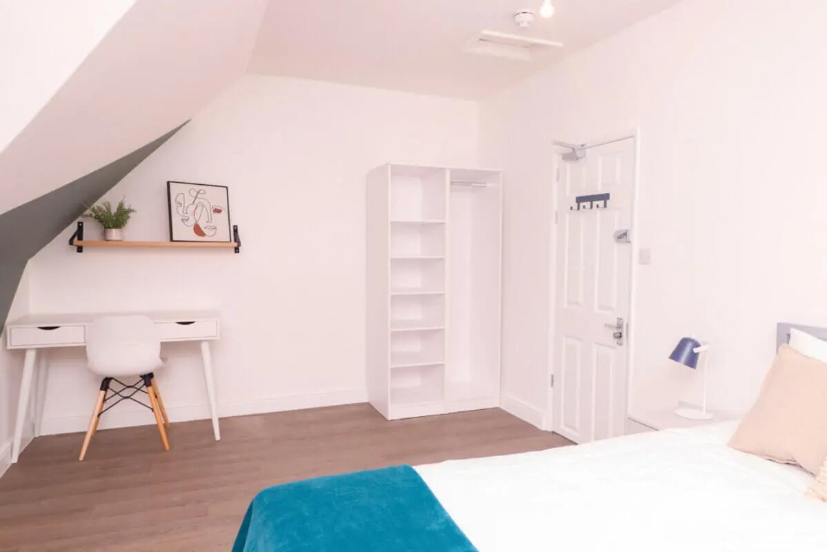Desk chair shelf closet and bed bedroom at 5 Bedroom House at 99, Monks Road in Lincoln Student Accommodation