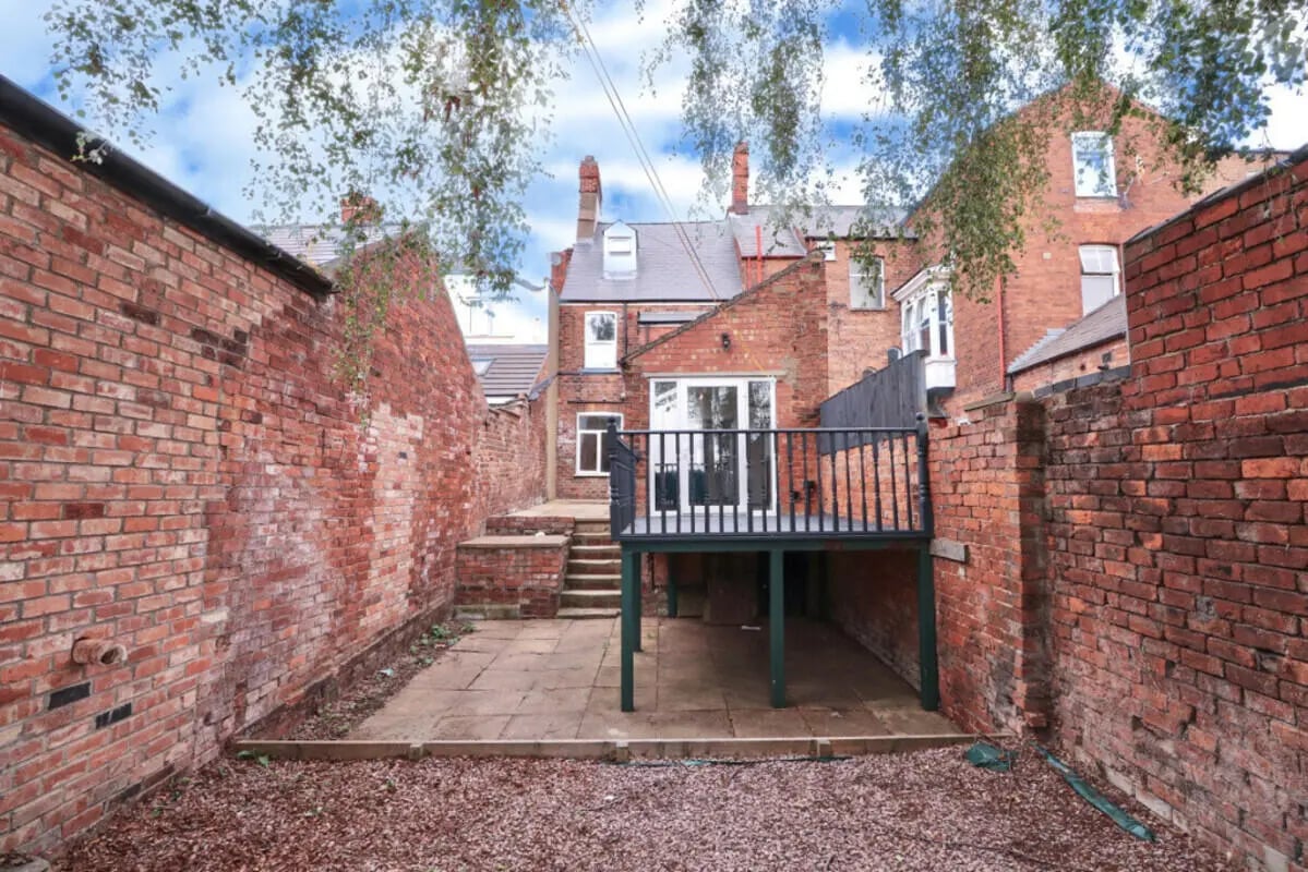 Deck with stairs leading to patio exterior at 5 Bedroom House at 99, Monks Road in Lincoln Student Accommodation