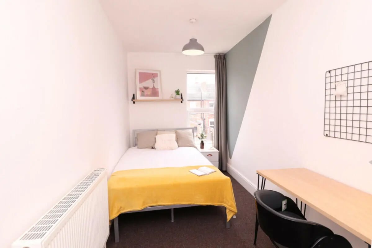 Bed radiator shelf art and desk bedroom at 5 Bedroom House at 43, Thesiger Street in Lincoln Student Accommodation