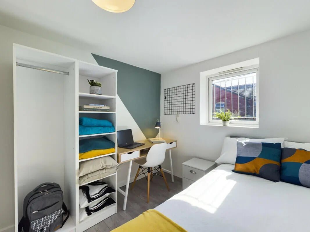 Bed desk closet and backpack bedroom at 2 Bedroom House at Flat 2 30, Haydn Avenue in Manchester Student Accommodation