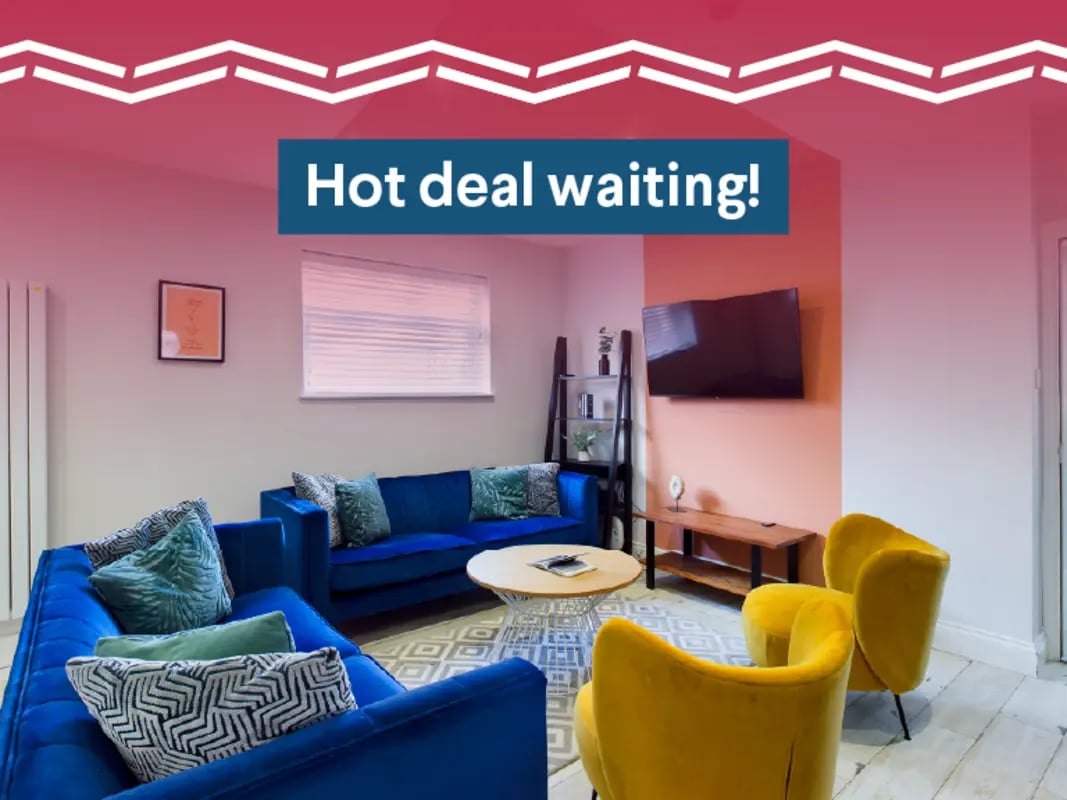 Blue sofas round table yellow armchairs living room at 8 Bedroom House at 211, Molyneux Road in Liverpool Student Accommodation