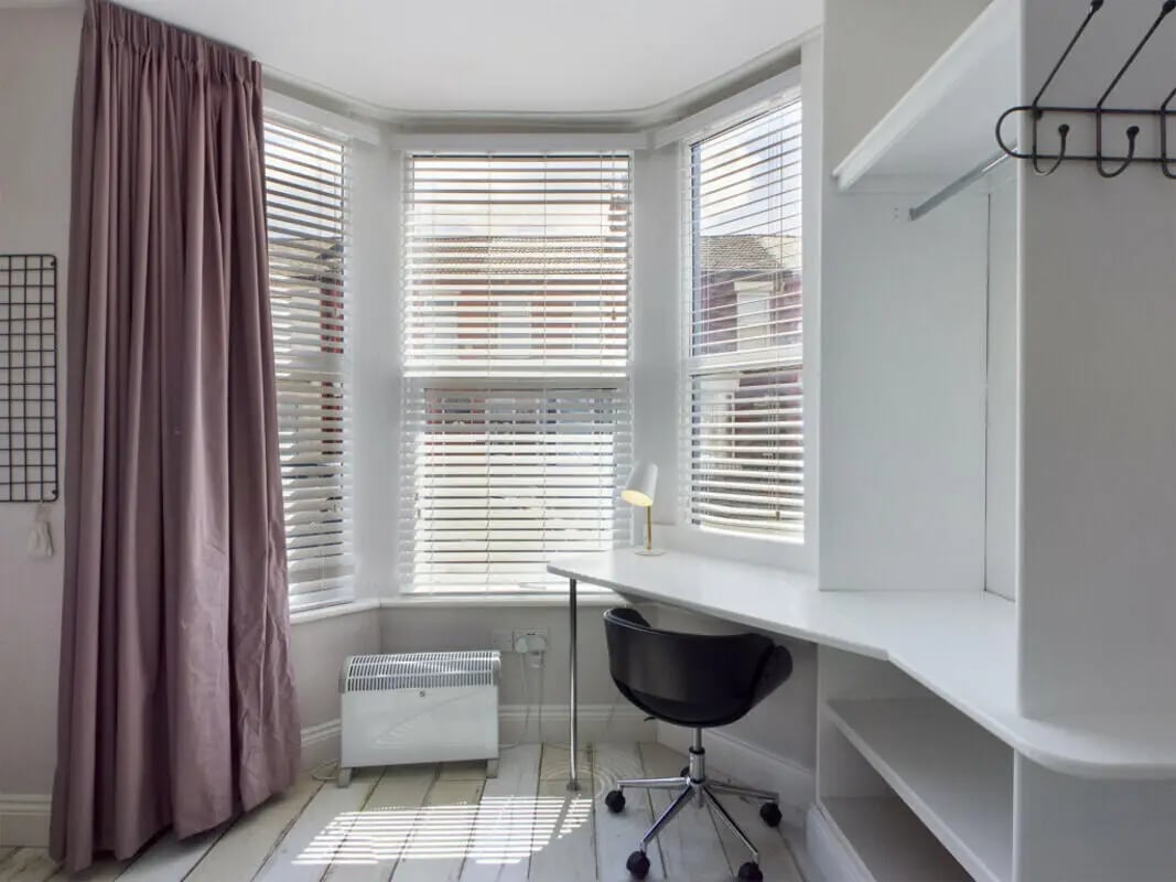 Desk heater lamp chair shelf study area at 8 Bedroom House at 211, Molyneux Road in Liverpool Student Accommodation