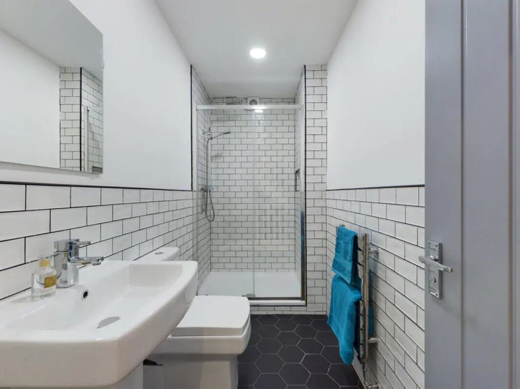 Sink toilet shower with tiled walls bathroom at 8 Bedroom House at 211, Molyneux Road in Liverpool Student Accommodation