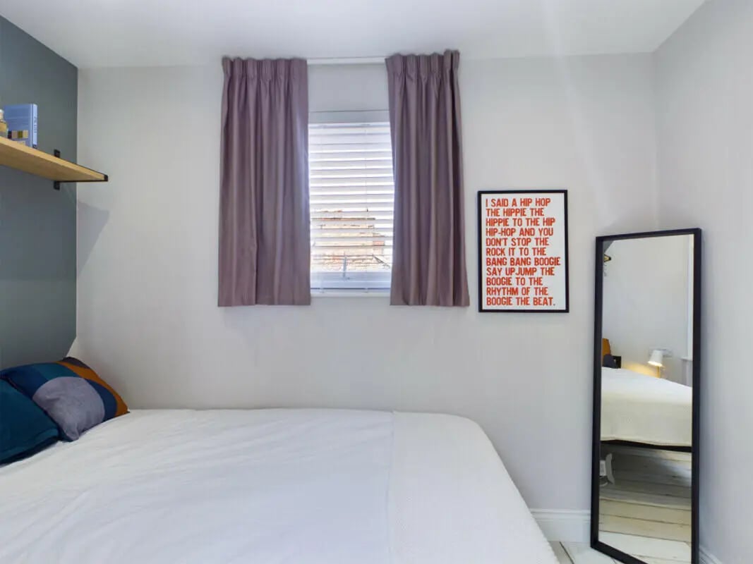 Bed pillows picture frame mirror bedroom at 8 Bedroom House at 211, Molyneux Road in Liverpool Student Accommodation