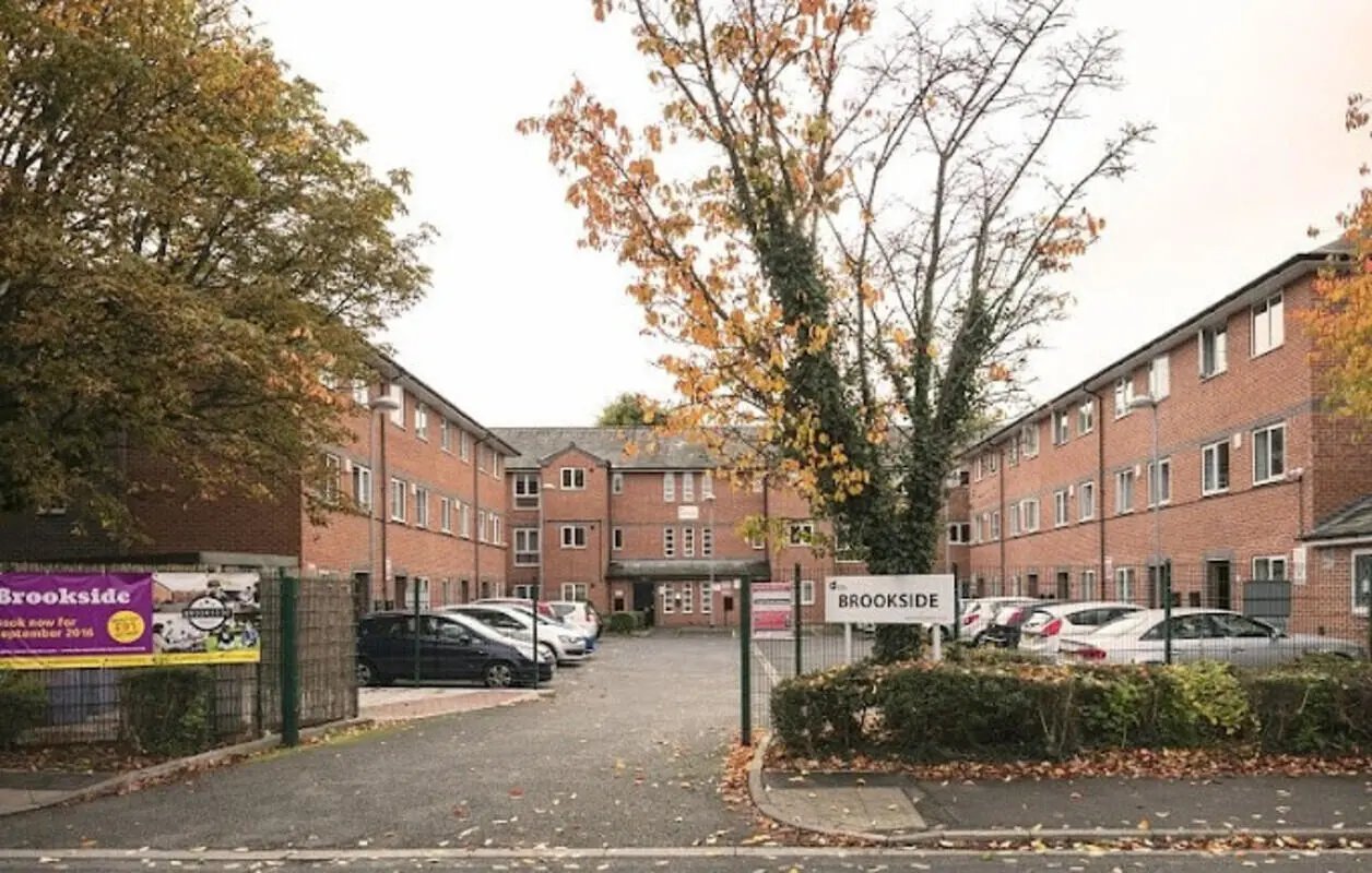 Brookside accommodation brick building parked cars exterior at 4 Bedroom House at 11, Brookside in Derby Student Accommodation
