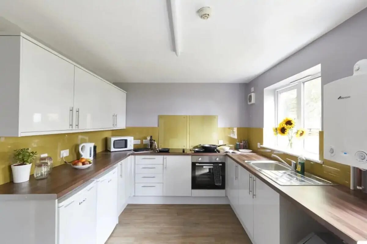 White cabinets microwave oven kettle sink kitchen at 4 Bedroom House at 15, Brookside in Derby Student Accommodation