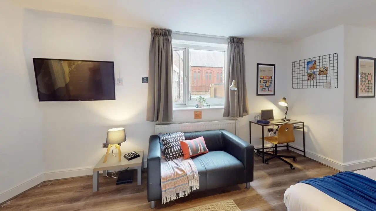 Sofa desk television and bed living room at 1 Bedroom House at Flat 3, 265, Edge Lane in Liverpool Student Accommodation