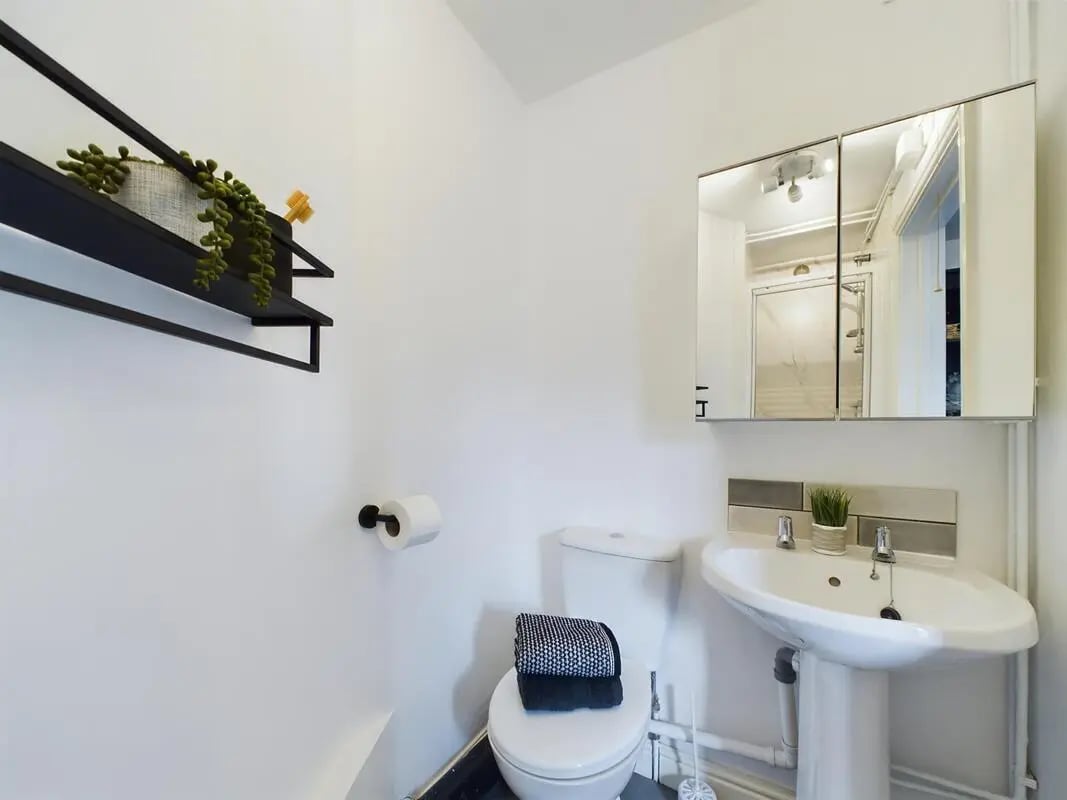 Toilet sink medicine cabinet and shelf bathroom at 4 Bedroom House at 75, West Parade in Lincoln Student Accommodation