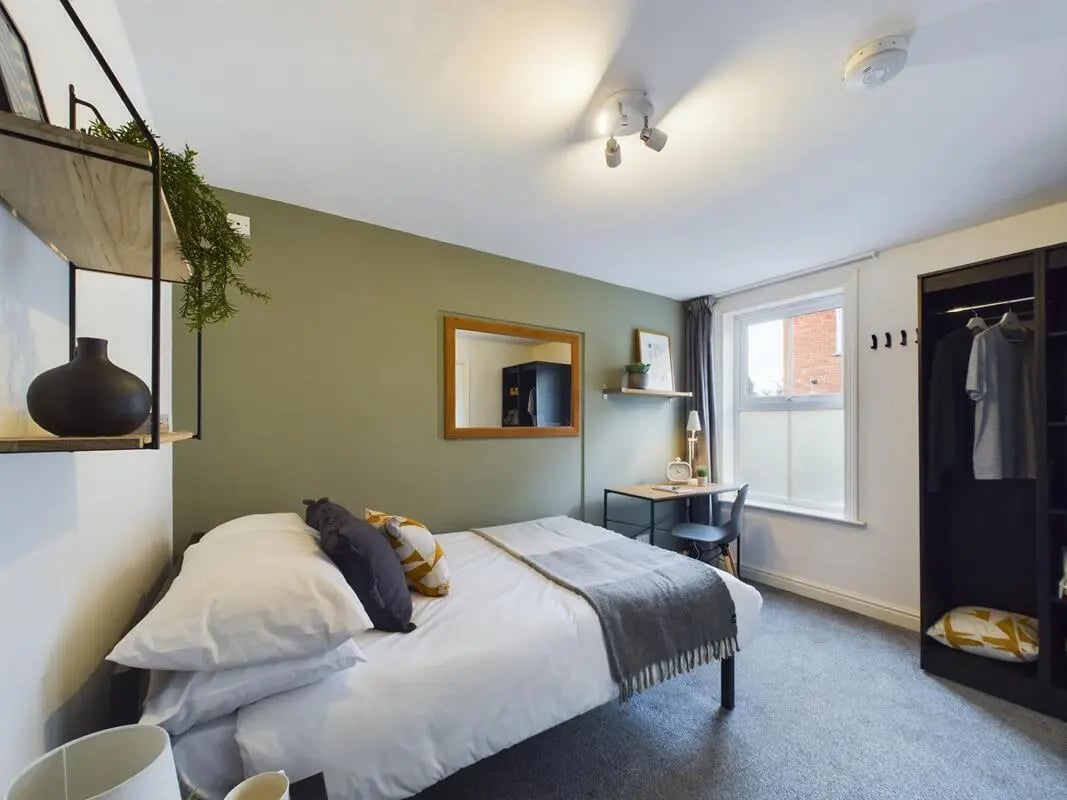 Bed desk wardrobe with clothes Bedroom at 4 Bedroom House at 75, West Parade in Lincoln Student Accommodation
