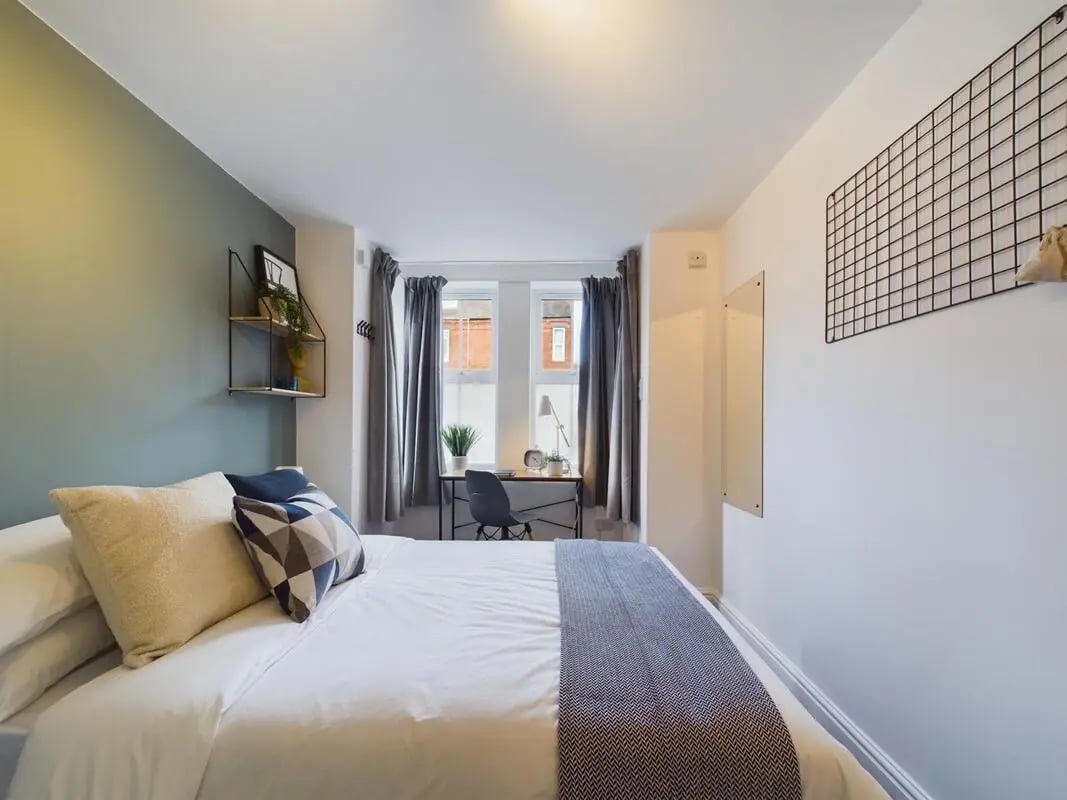 Bed desk chair and window bedroom at 4 Bedroom House at 75, West Parade in Lincoln Student Accommodation