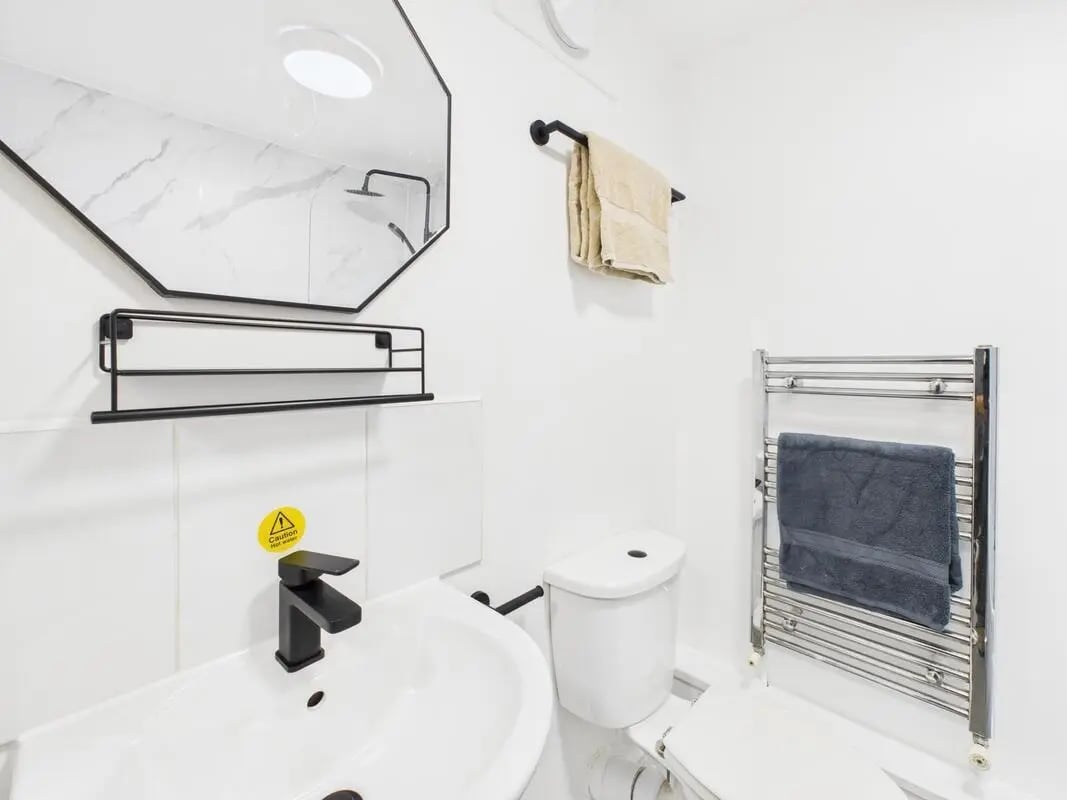 White sink faucet shelf mirror and toilet Bathroom at 2 Bedroom House at Flat 1, Grove Street Studios, The Groves in Liverpool Student Accommodation