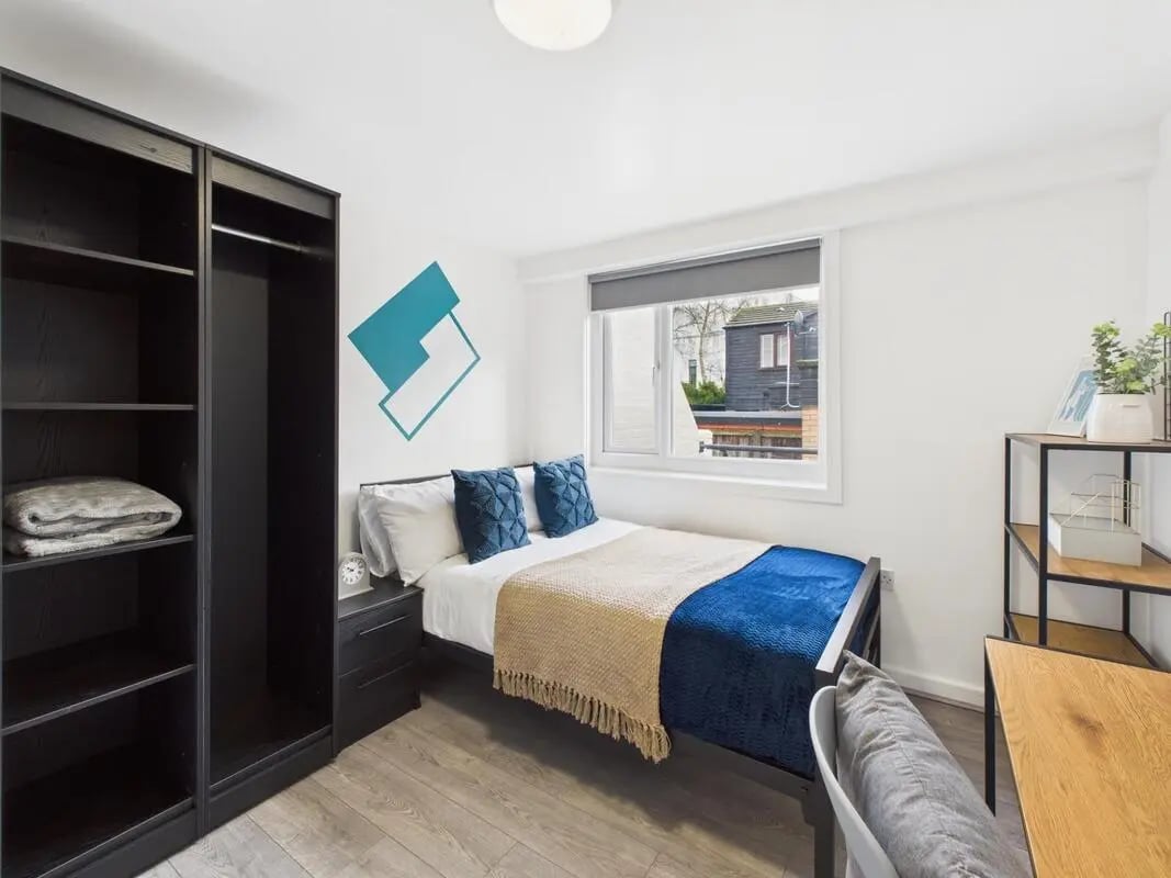 Bed wardrobe nightstand desk and shelves bedroom at 2 Bedroom House at Flat 8, Grove Street Studios, The Groves in Liverpool Student Accommodation