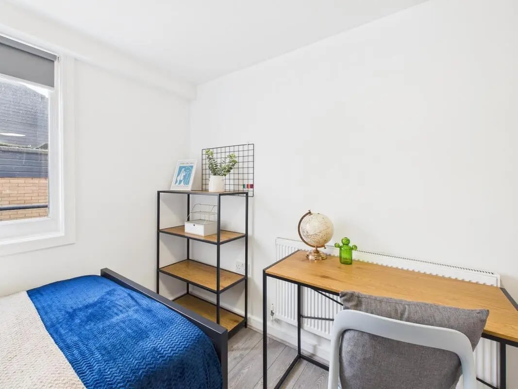 Bed desk shelf globe chair bedroom study area at 2 Bedroom House at Flat 8, Grove Street Studios, The Groves in Liverpool Student Accommodation
