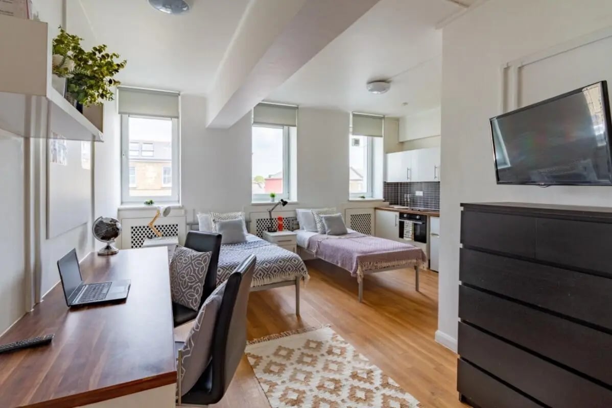 Two beds desk kitchen and TV studio apartment at Portobello Garrow House in London Student Accommodation